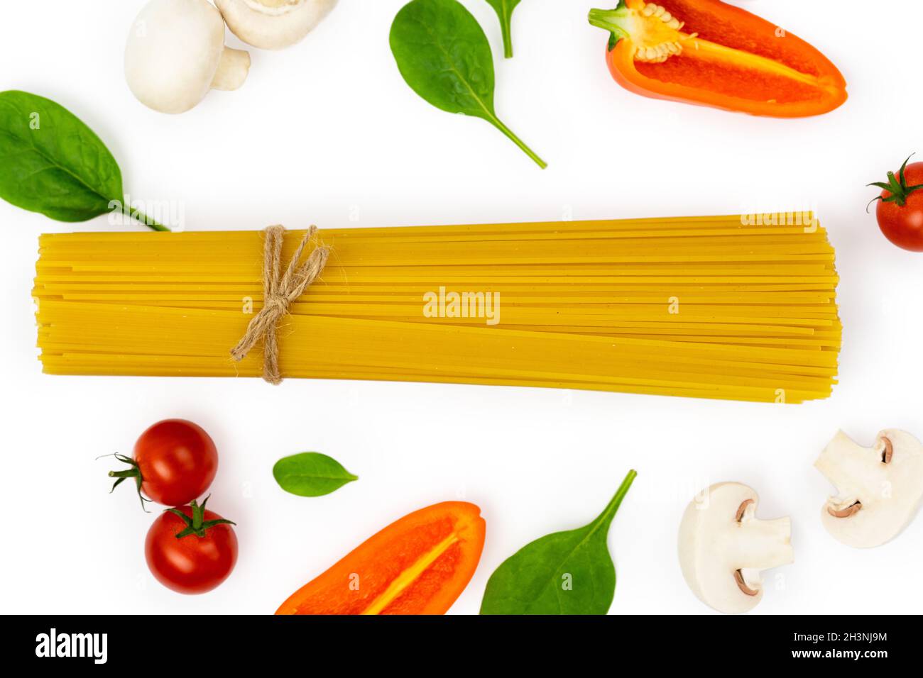 Fresh vegetables and spaghetti, ingredients for making pasta. Cooking