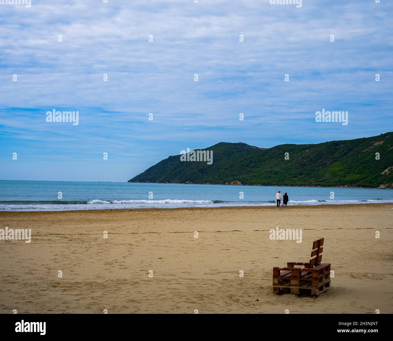 Couple walking in the beach Stock Photo