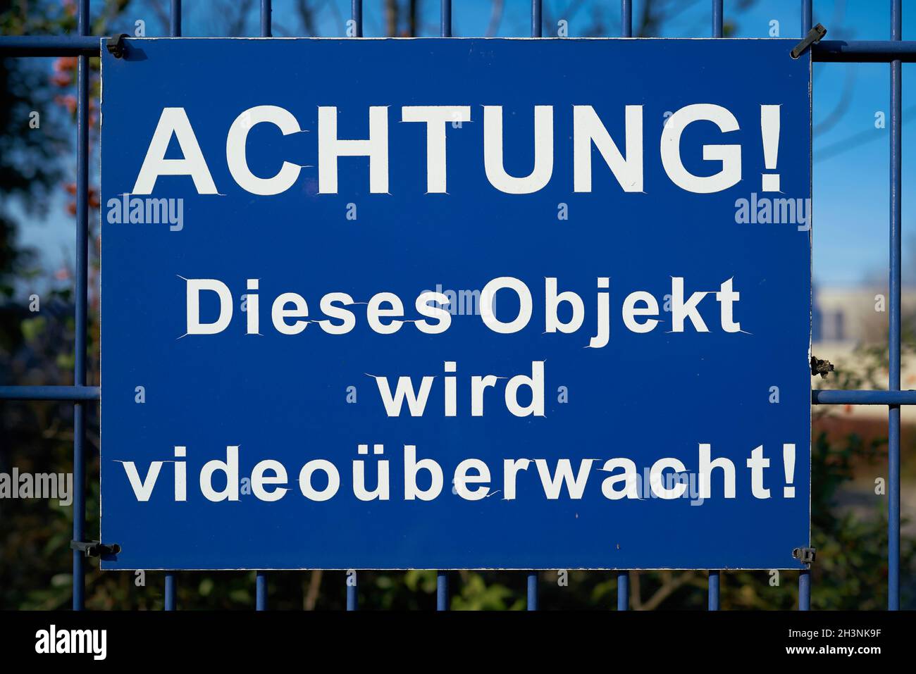 Blue sign with the inscription Attention, this object is under video ...