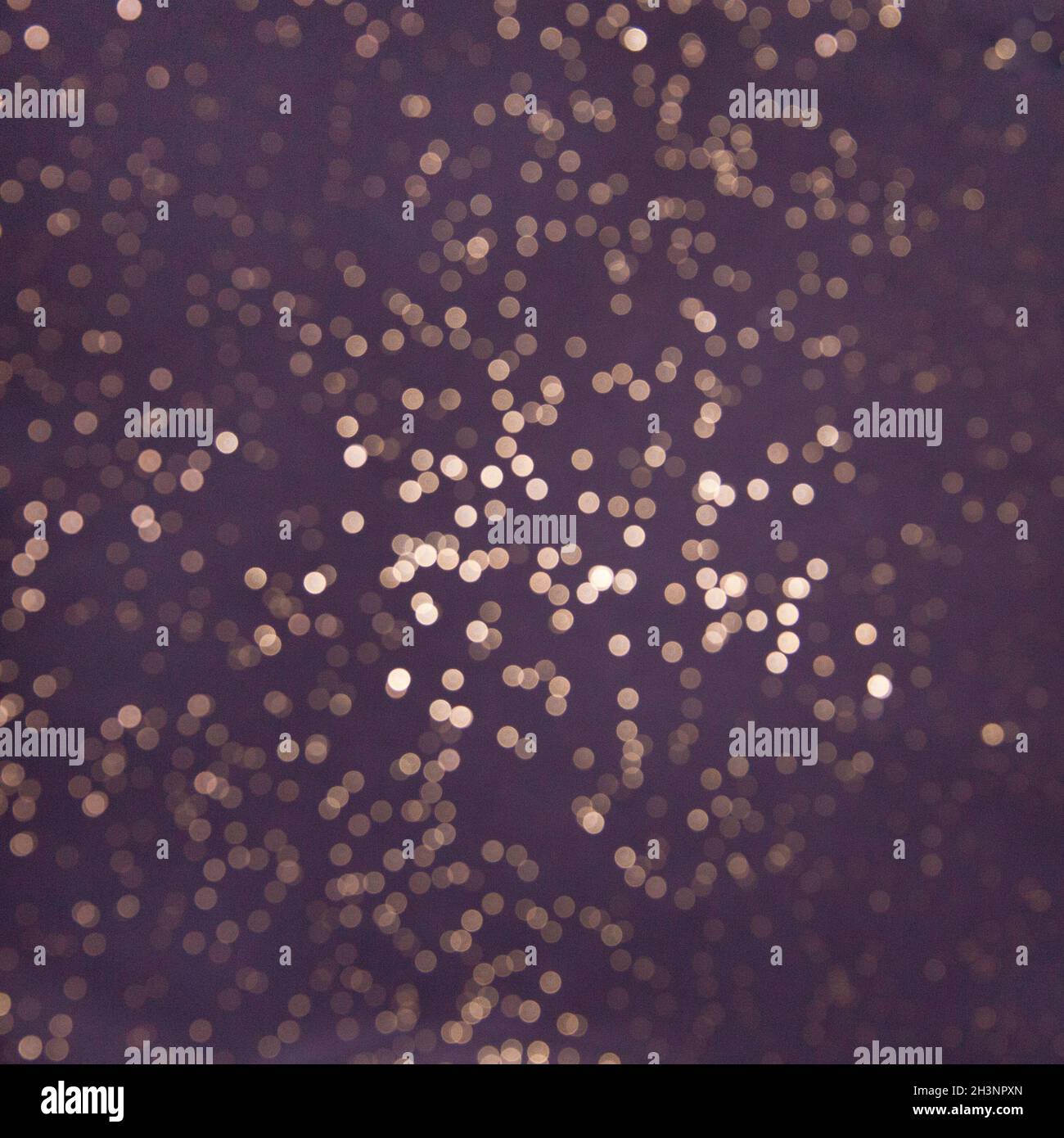 pink abstract glitter bokeh lights. defocused. gold abstraction bokeh lights. delocalized background. Lilac background. Stock Photo
