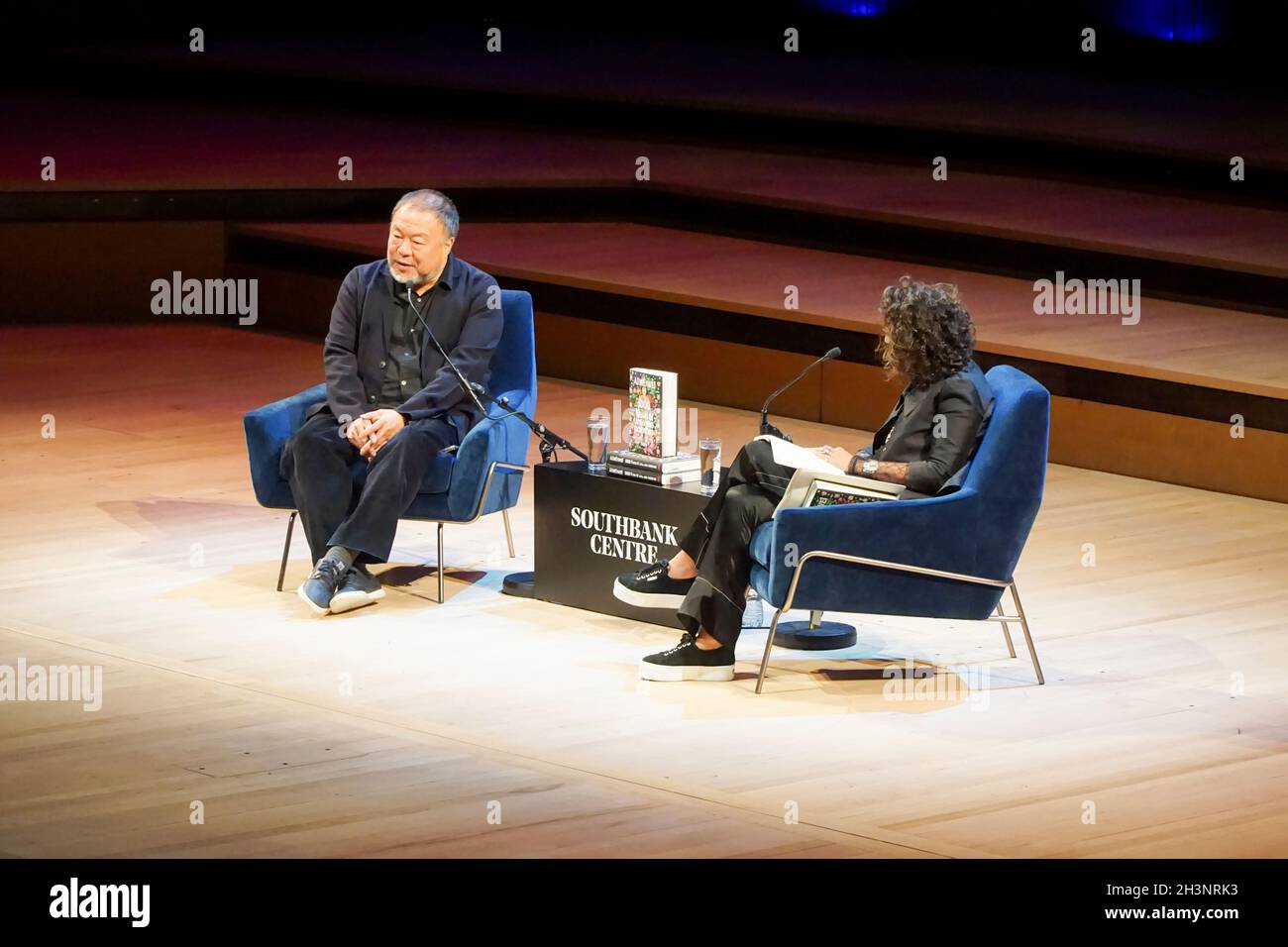 London, UK, 29 October 2021: Artist Ai Weiwei launched his autobiography '1000 Years of Joys and Sorrows' at the Royal Festival Hall as part of the London Literature Festival. The artist was interviewed by BBC journalist Razia Iqbal about his family background in China, his detention by the Chinese authorities and his art. To mark the occasion, a new artwork by Ai was projected on the outside of the building, comprising quotations from an international selection of writers and activists. Anna Watson/Alamy Live News Stock Photo