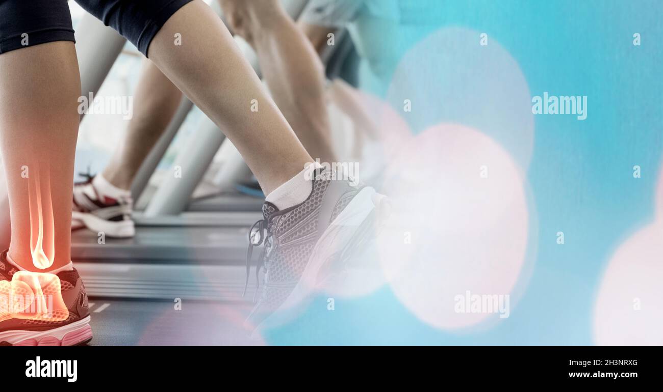 Feet bones of man and woman walking on treadmills for healthy lifestyle in fitness club Stock Photo
