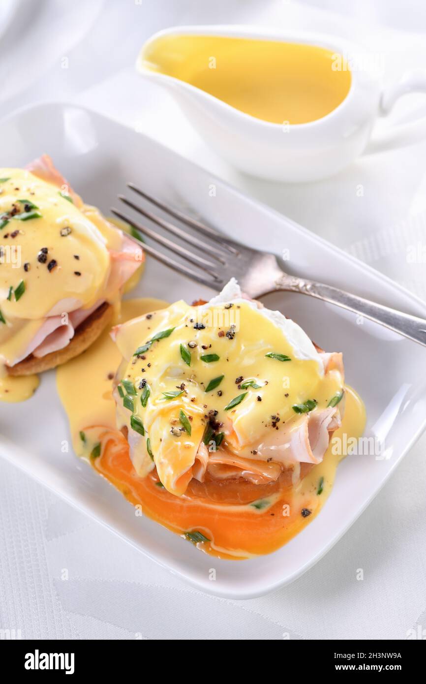 Breakfast. Best Eggs Benedict fried English bun, ham, poached eggs