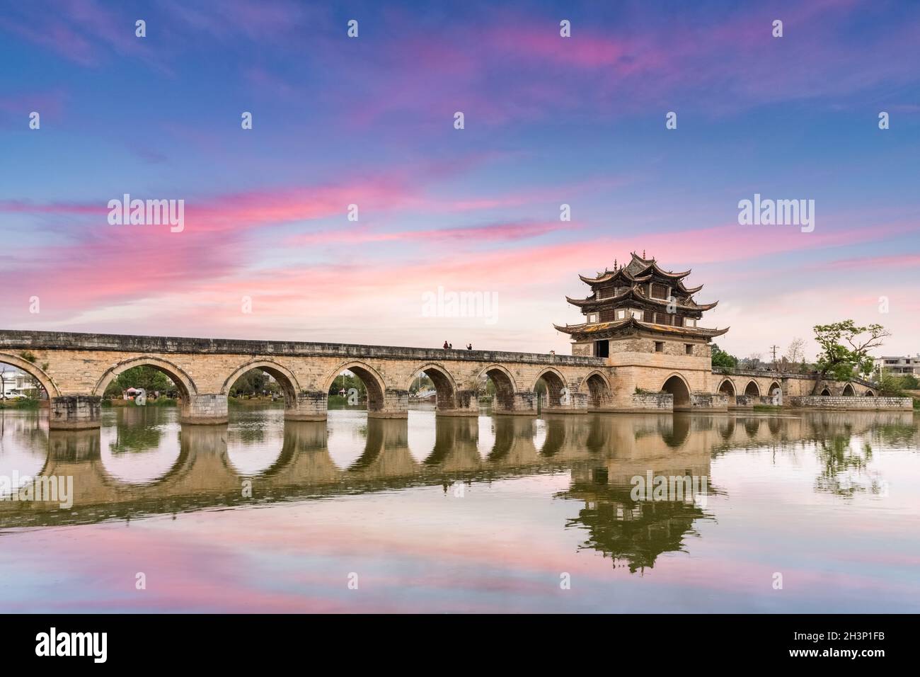 Yunnan double dragon bridge in twilight Stock Photo