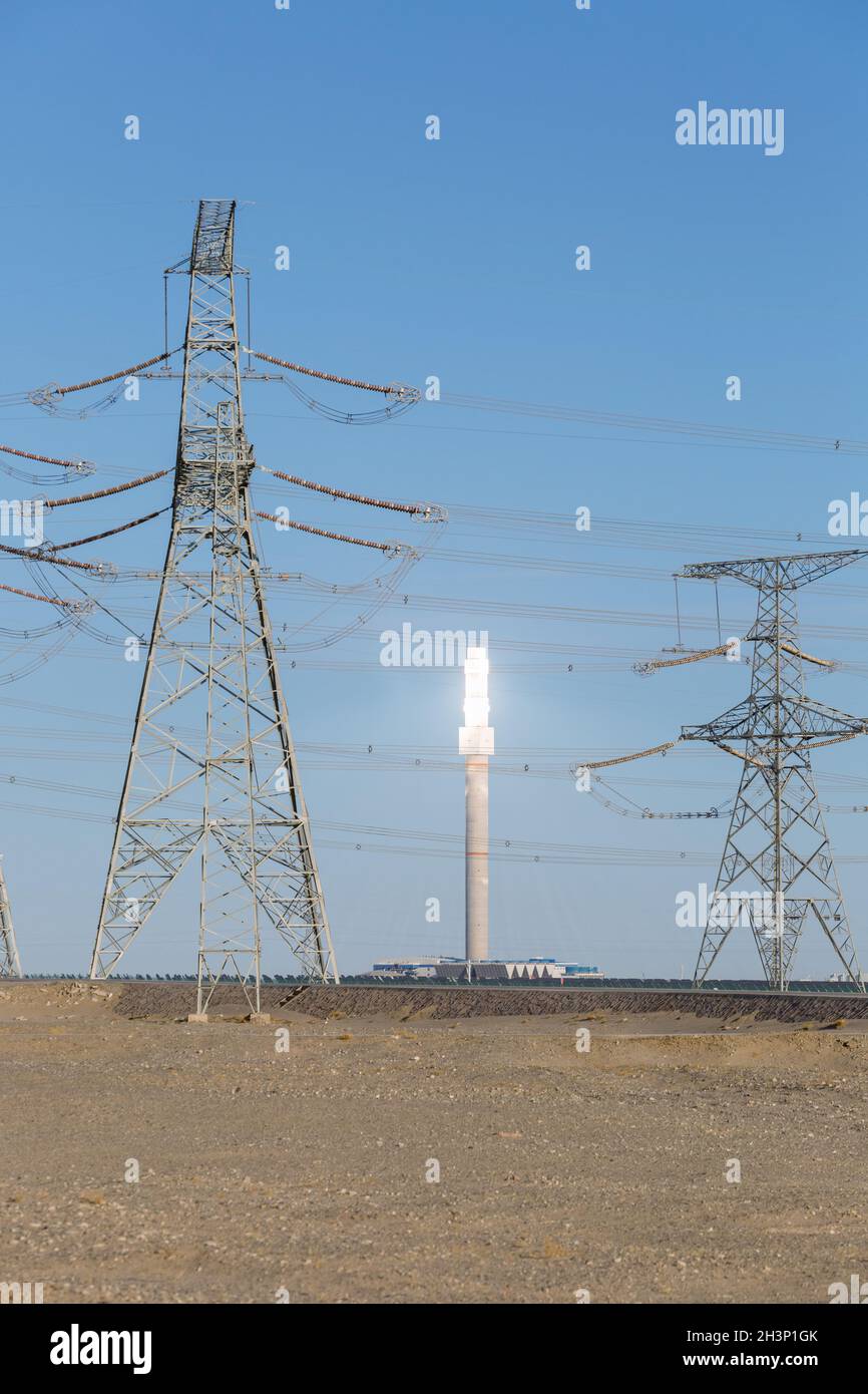 Molten salt tower and power transmission tower, Stock Photo