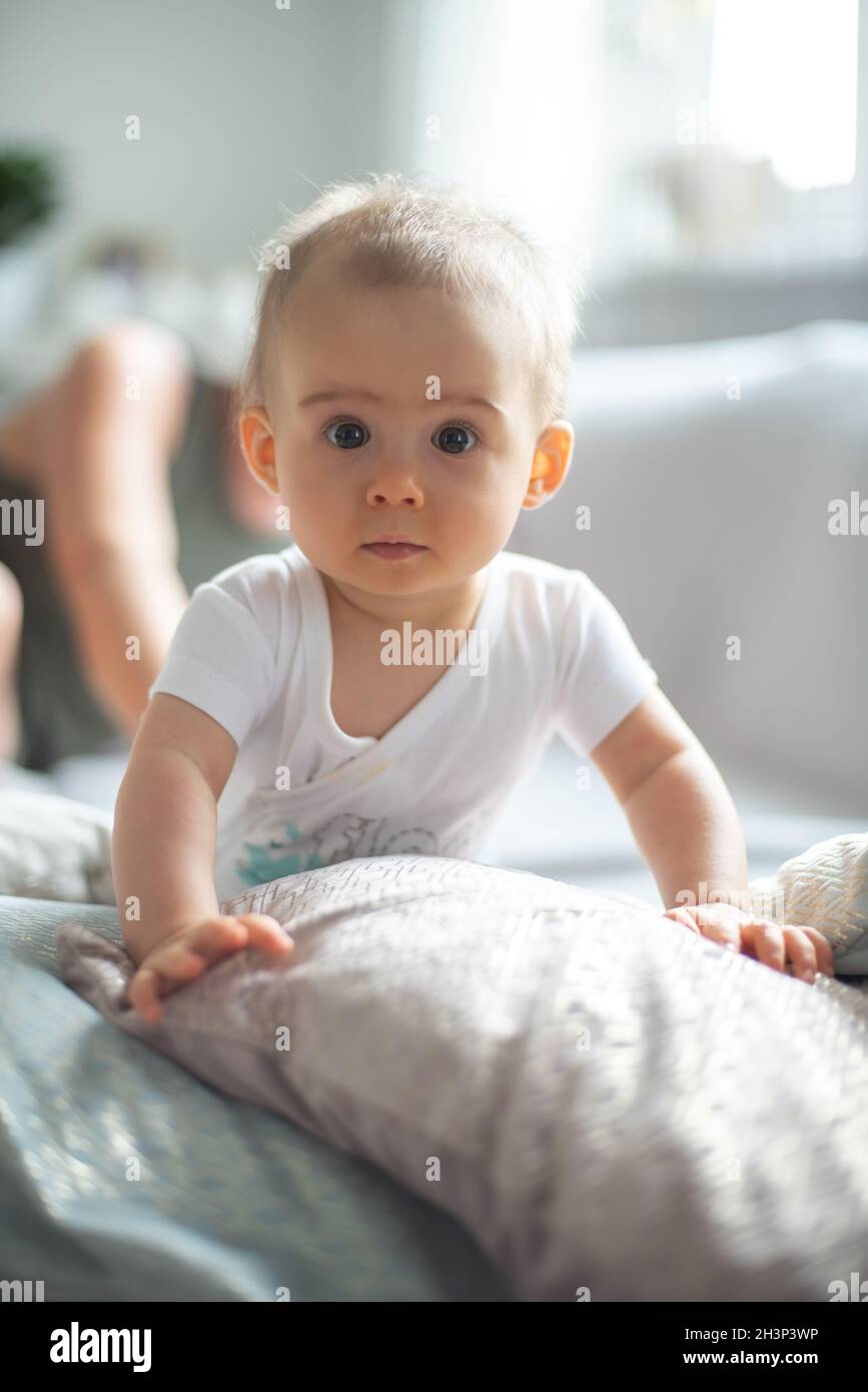 Baby lifting herself from belly up Stock Photo Alamy