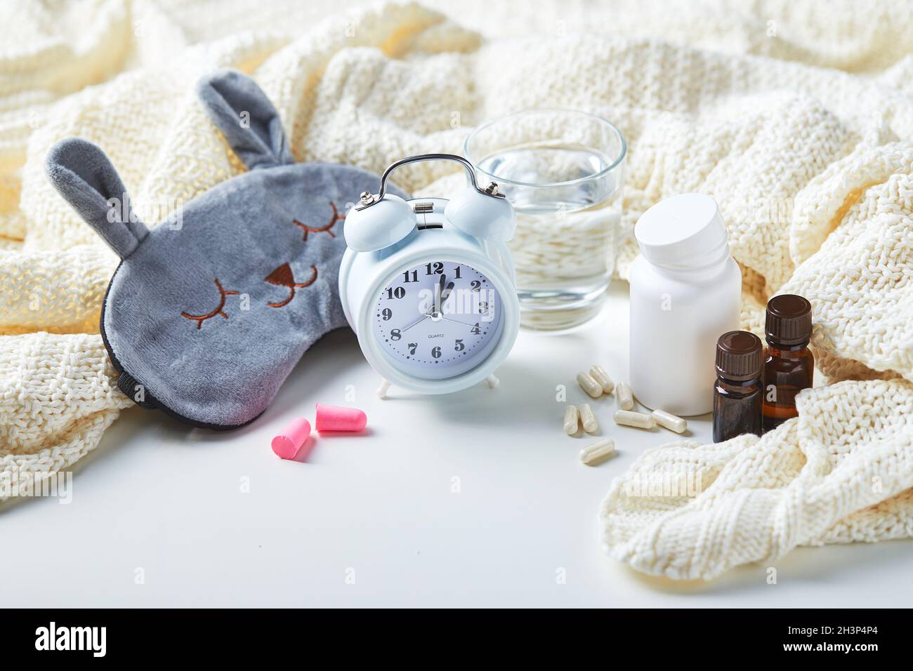 Sleeping mask, alarm clock, earplugs and pills. Healthy night sleep