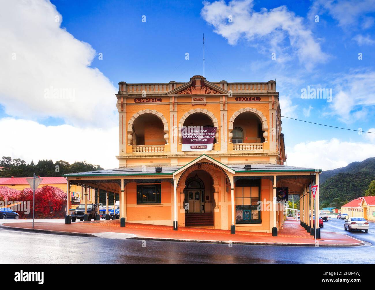Queenstown, Australia - 24 April 2014: Facade of historic Empire hotel in old mining town on Tasmanian West coast under blue sky. Stock Photo