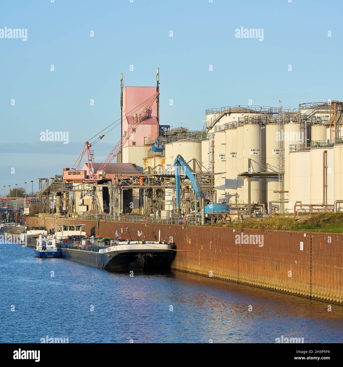 Ships in the industrial port in the north of Magdeburg in Germany Stock Photo