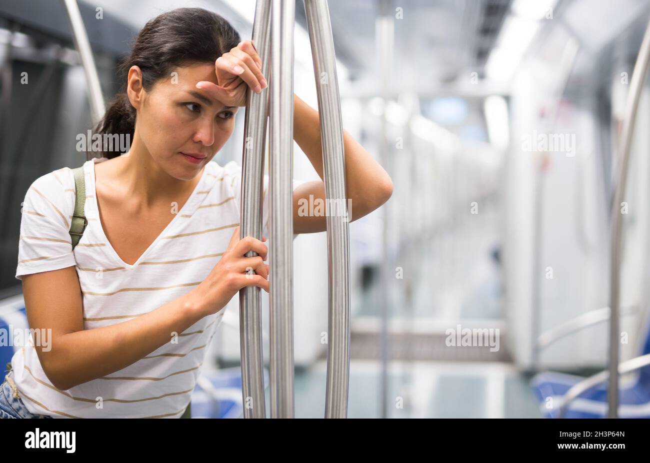 Lonely woman waiting train hi-res stock photography and images - Alamy