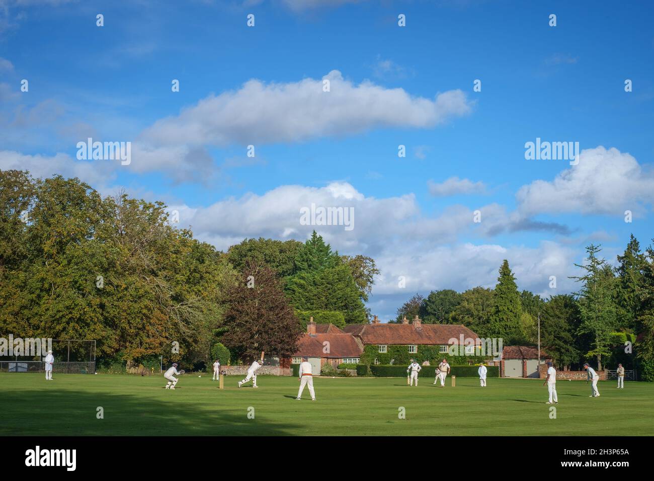 Village cricket on the village green at Rotherfield Greys, Oxfordshire Stock Photo