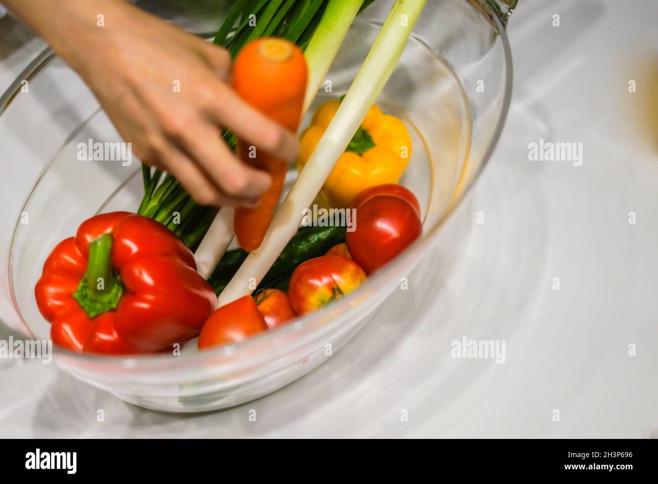 Green and yellow vegetables, which are placed in the wine cooler Stock Photo