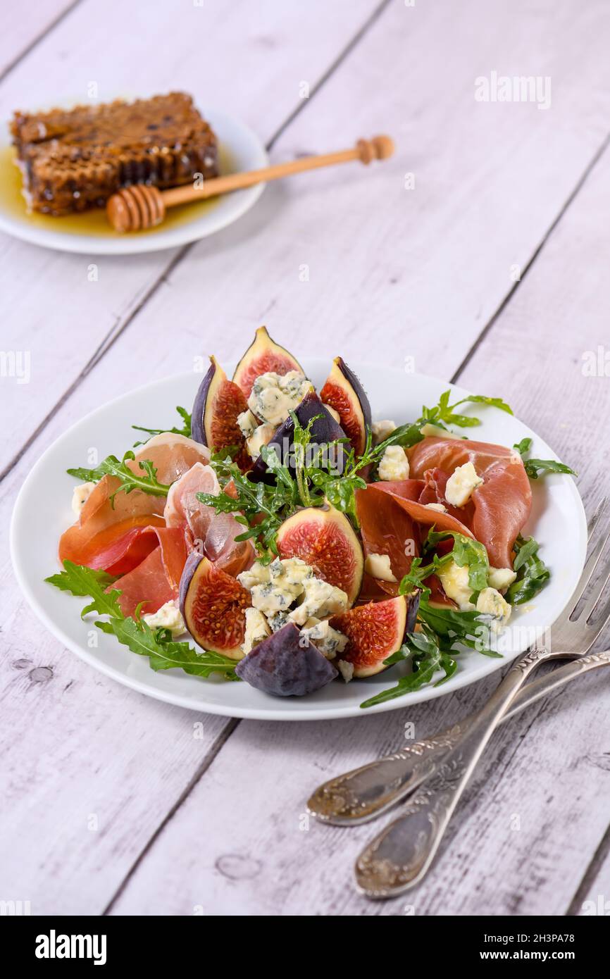 Prosciutto with figs and blue cheese Stock Photo Alamy