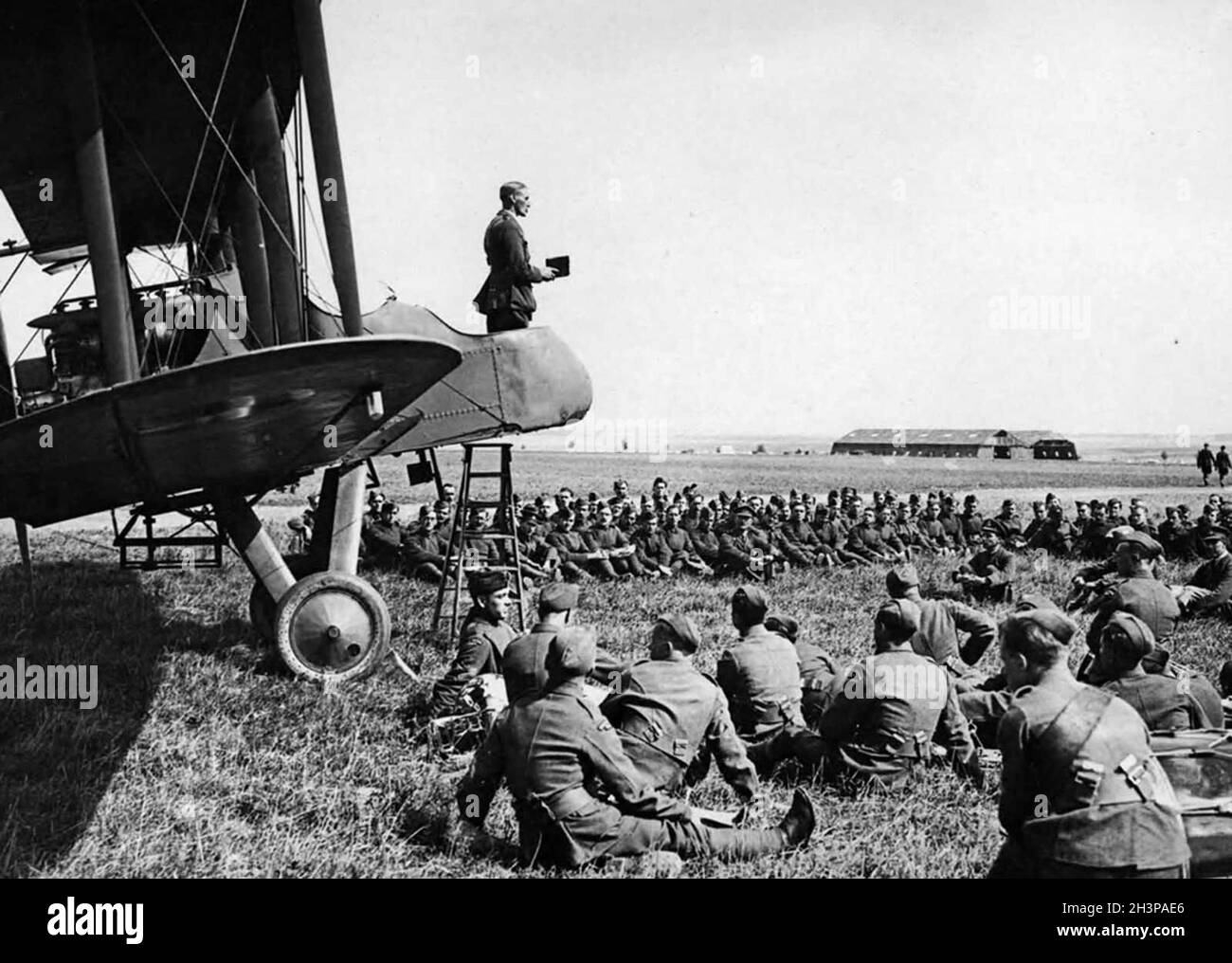 A chaplain conducting the service from an aeroplane on an airfield on the Western front. Stock Photo