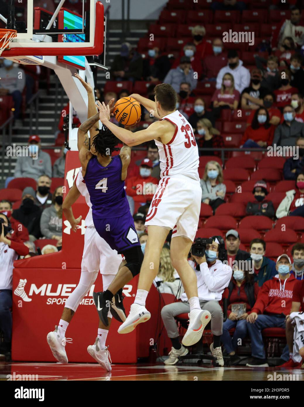 Madison, WI, USA. 29th Oct, 2021. Wisconsin Badgers center Chris Vogt (33) with a block during the NCAA Basketball game between the UW-Whitewater Warhawks and the Wisconsin Badgers at the Kohl Center