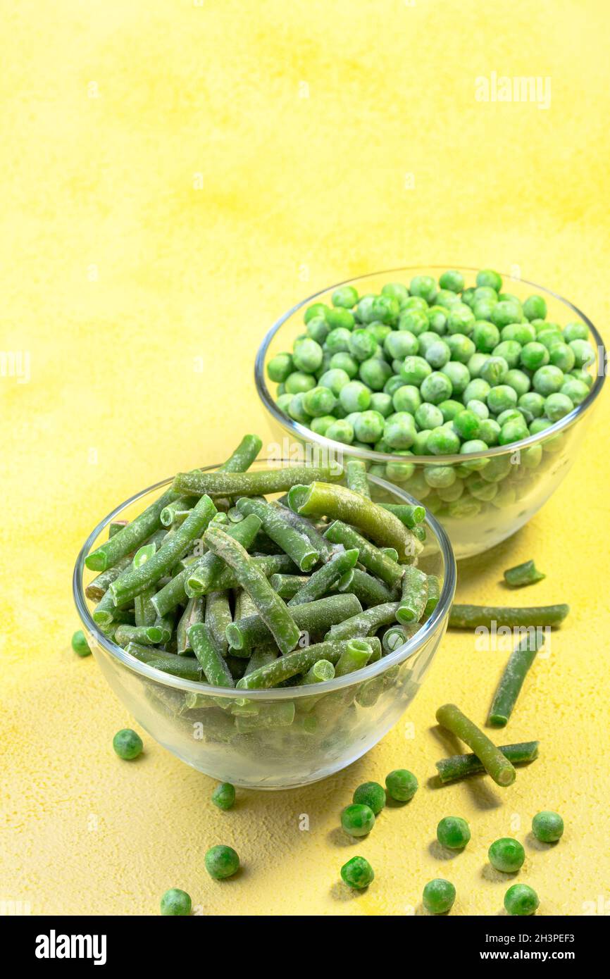 Quickfrozen string beans and green peas Stock Photo Alamy