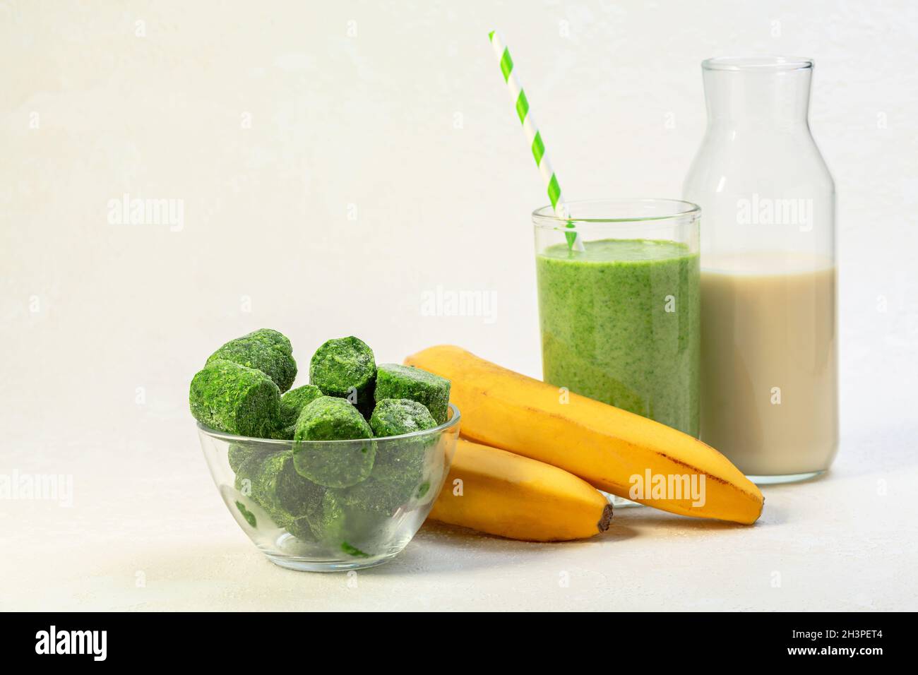 Spinach and banana smoothie with oat milk Stock Photo Alamy