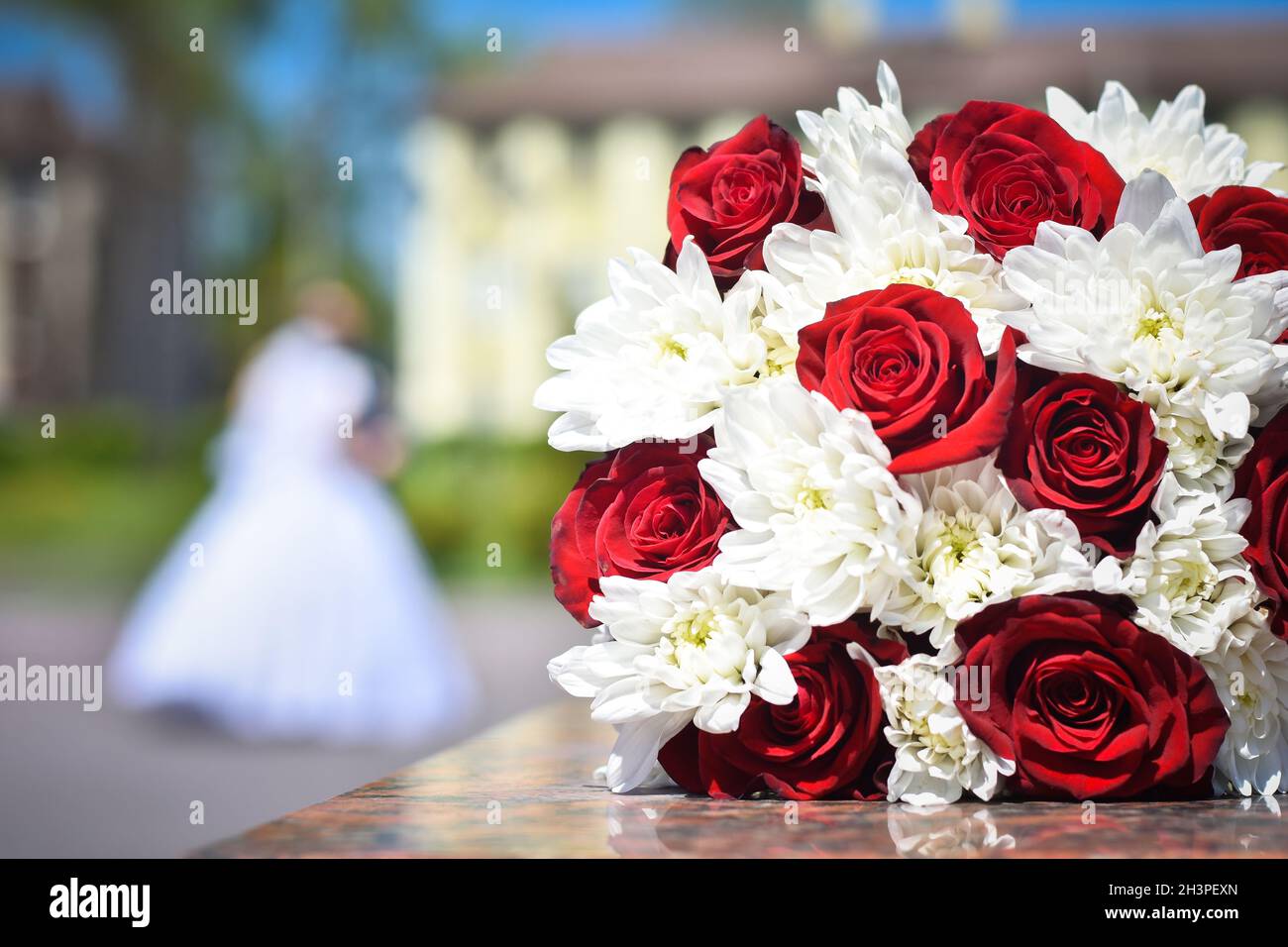 Woman Wearing White Gown With Red Roses On Background · Free Stock Photo