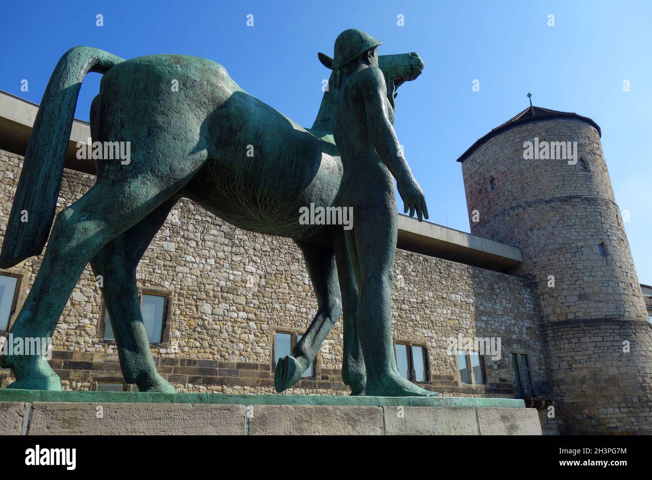 Man with horse and Begin tower in Hanover Stock Photo