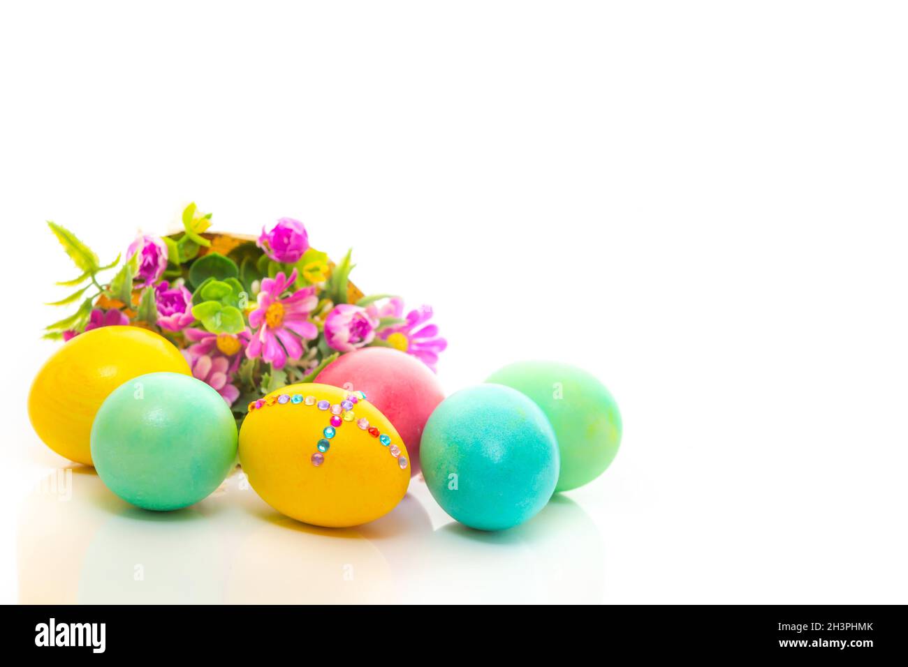 Easter eggs and flower bouquet on white background Stock Photo - Alamy