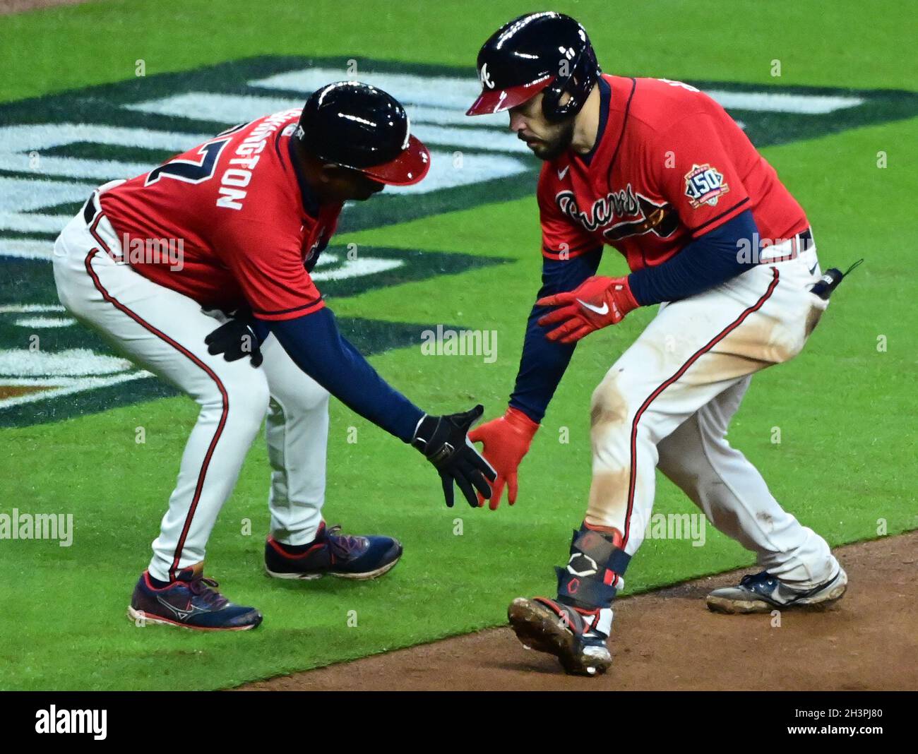 Atlanta, USA. 29th Oct, 2021. Atlanta Braves Travis d'Arnaud is  congratulated by third base coach Ron Washington after hitting a solo home  run to give the Braves a 2-0 lead in the