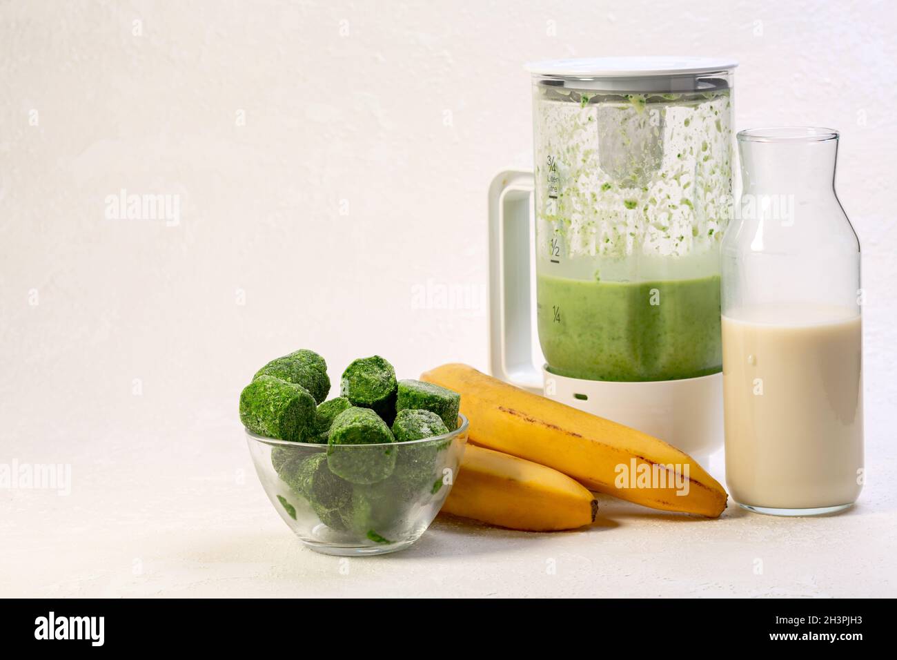 Frozen spinach and banana smoothie Stock Photo - Alamy