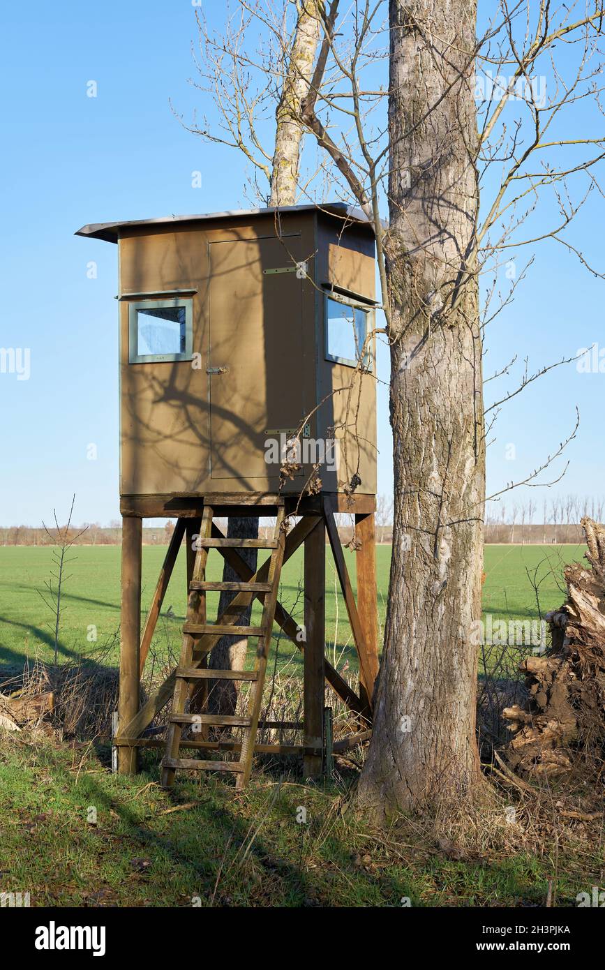 High seat of a hunter at the edge of a field near Magdeburg in Germany Stock Photo