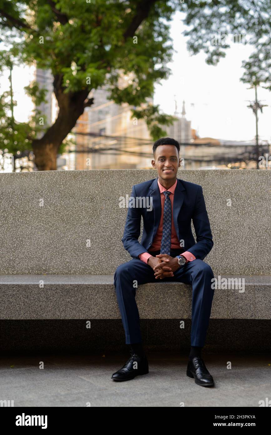 Portrait of young African businessman wearing suit and tie Stock Photo