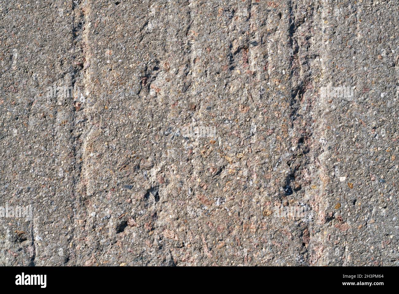 Grooves in a wall of concrete on a structure made of concrete Stock Photo
