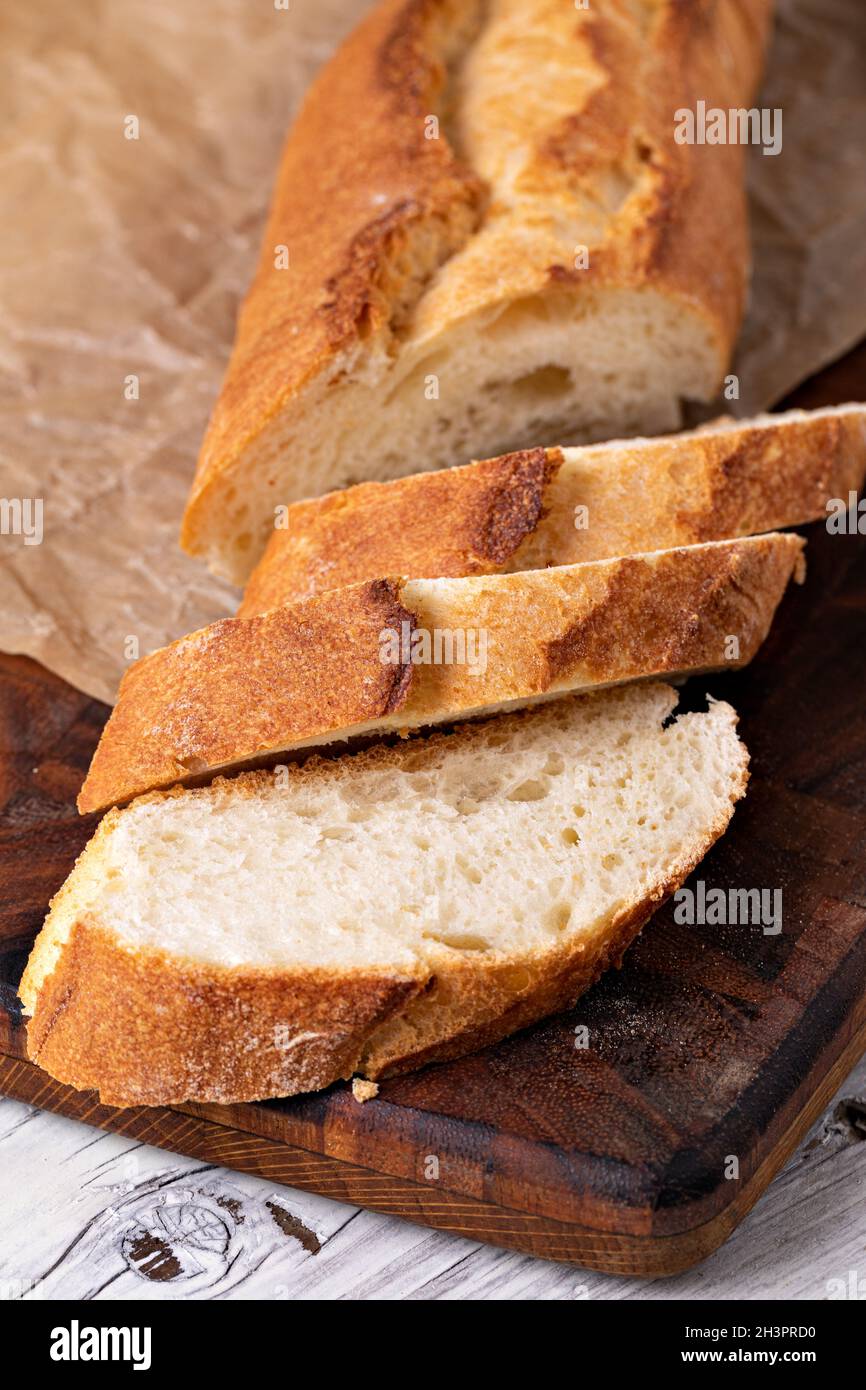 Baked bread on wooden table Stock Photo