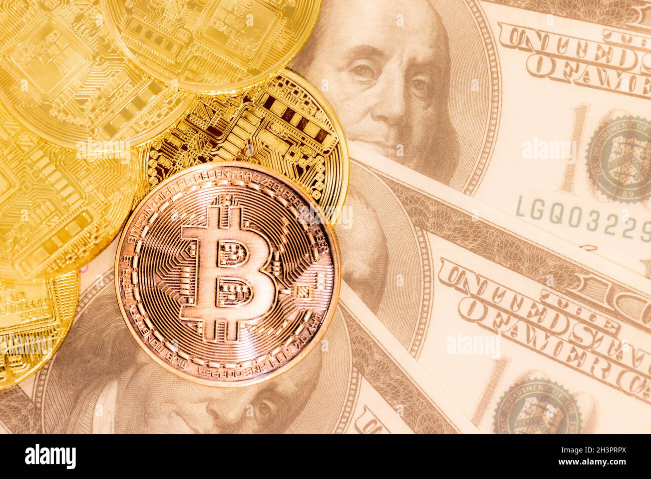 Golden coin bitcoin and dollars on laptop on the table of wealthy crypto  trader. Rich investor with large amount of cash dollars and golden bitcoin  co Stock Photo - Alamy