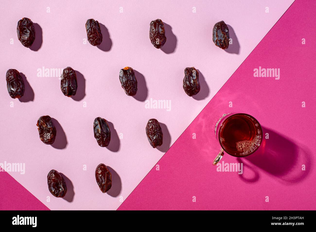 Glass of black tea and date fruit. Stock Photo