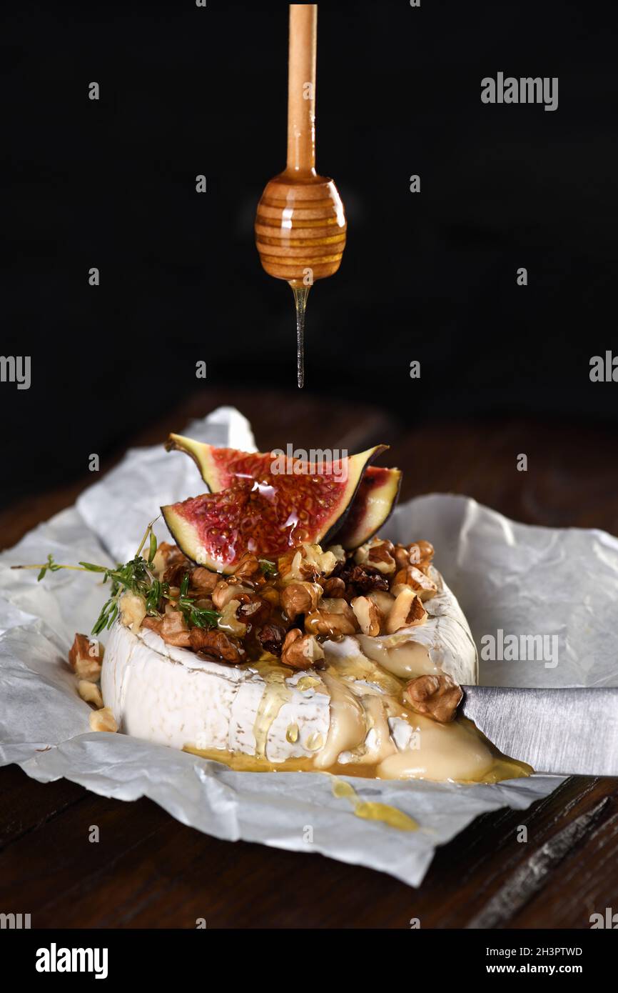 Baked brie cheese with nuts and honey Stock Photo Alamy