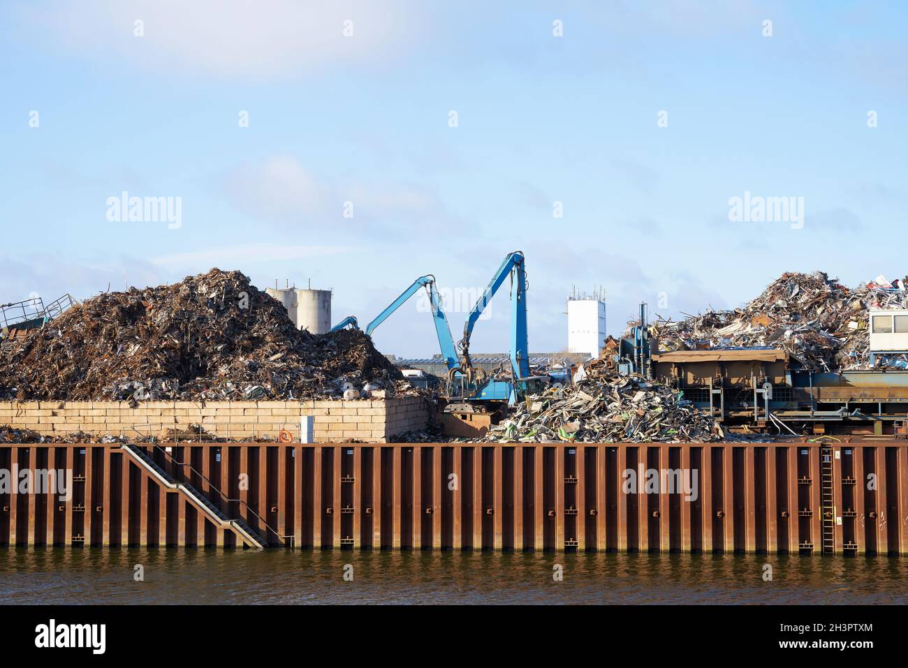 Scrap yard in the industrial port on the banks of the Elbe in Magdeburg in Germany Stock Photo