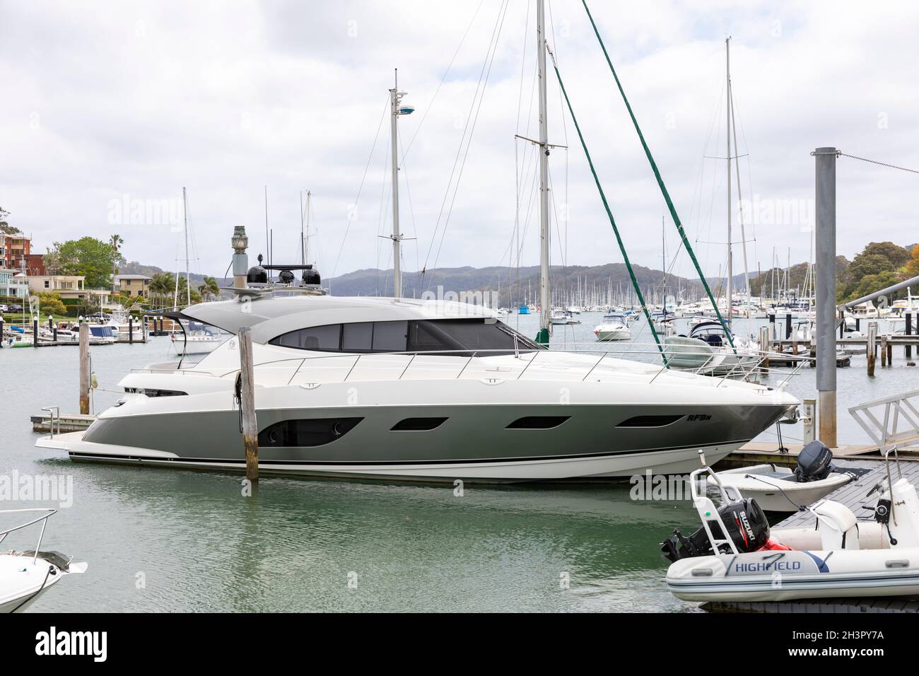 Large luxury Riviera made platinum cruising motor yacht moored on Pittwater in Sydney northern  beaches,New South Wales,Australia Stock Photo