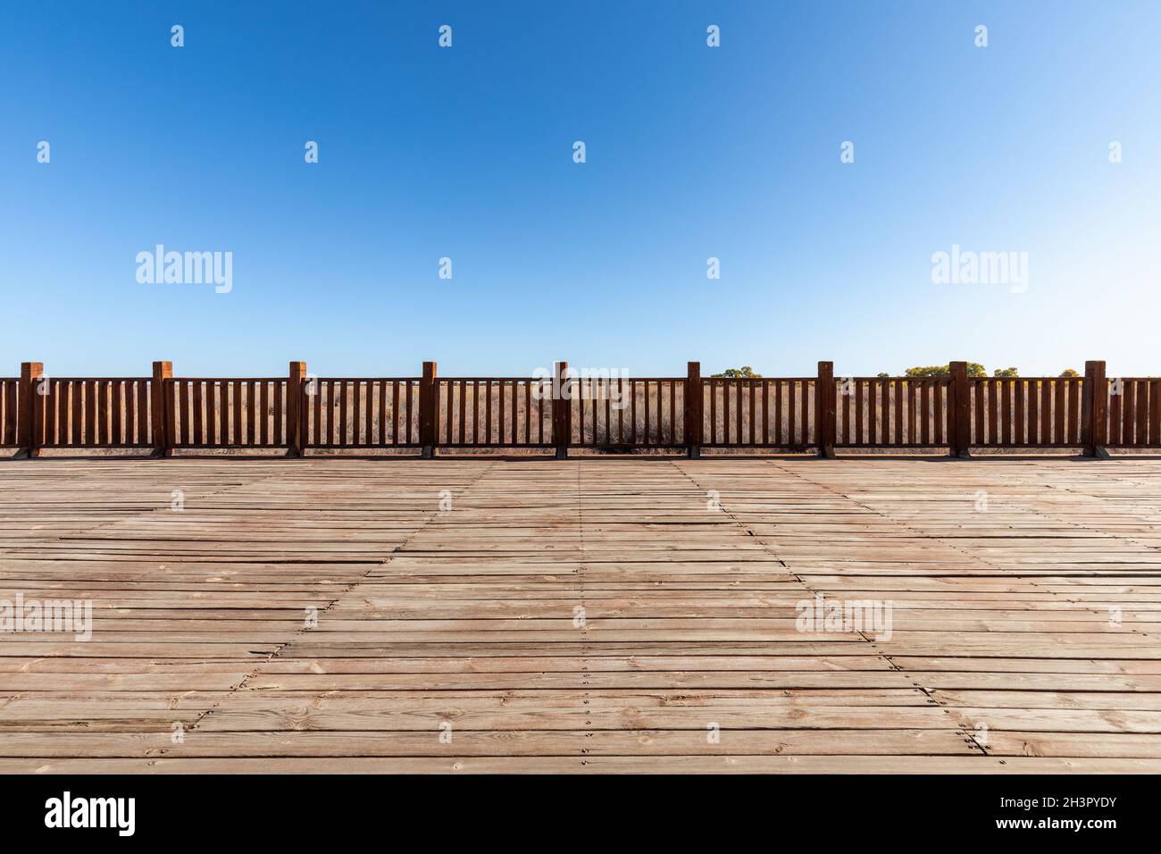 Wood floor and wooden railings in outdoor park Stock Photo