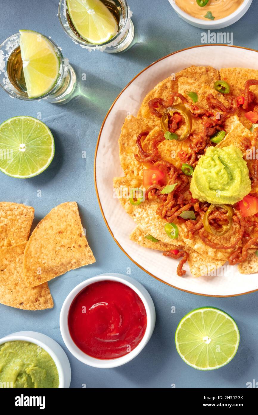 Nachos and tequila, Mexican party, top shot Stock Photo