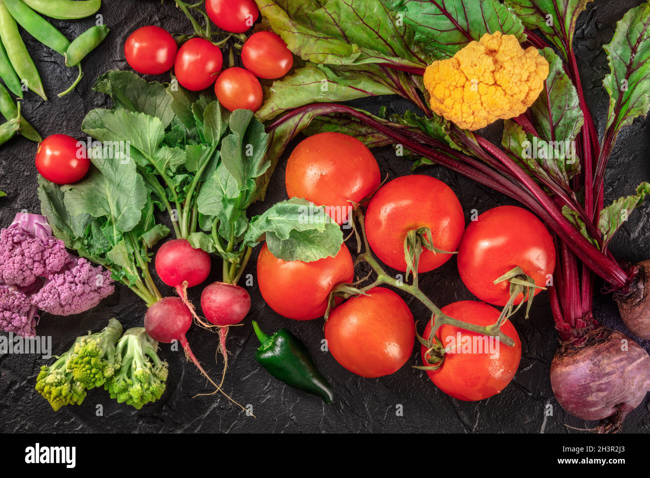 Fresh vegetables, top flat lay shot on a dark background Stock Photo