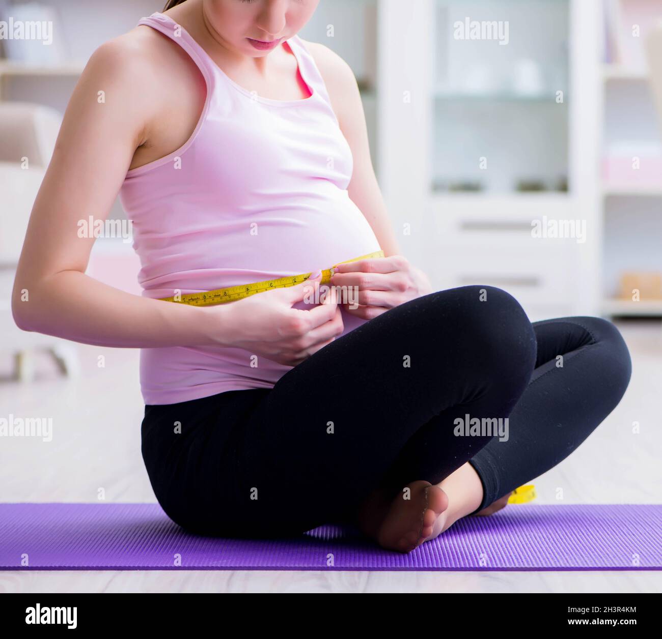 Pregnant woman exercising in anticipation of child birth Stock Photo