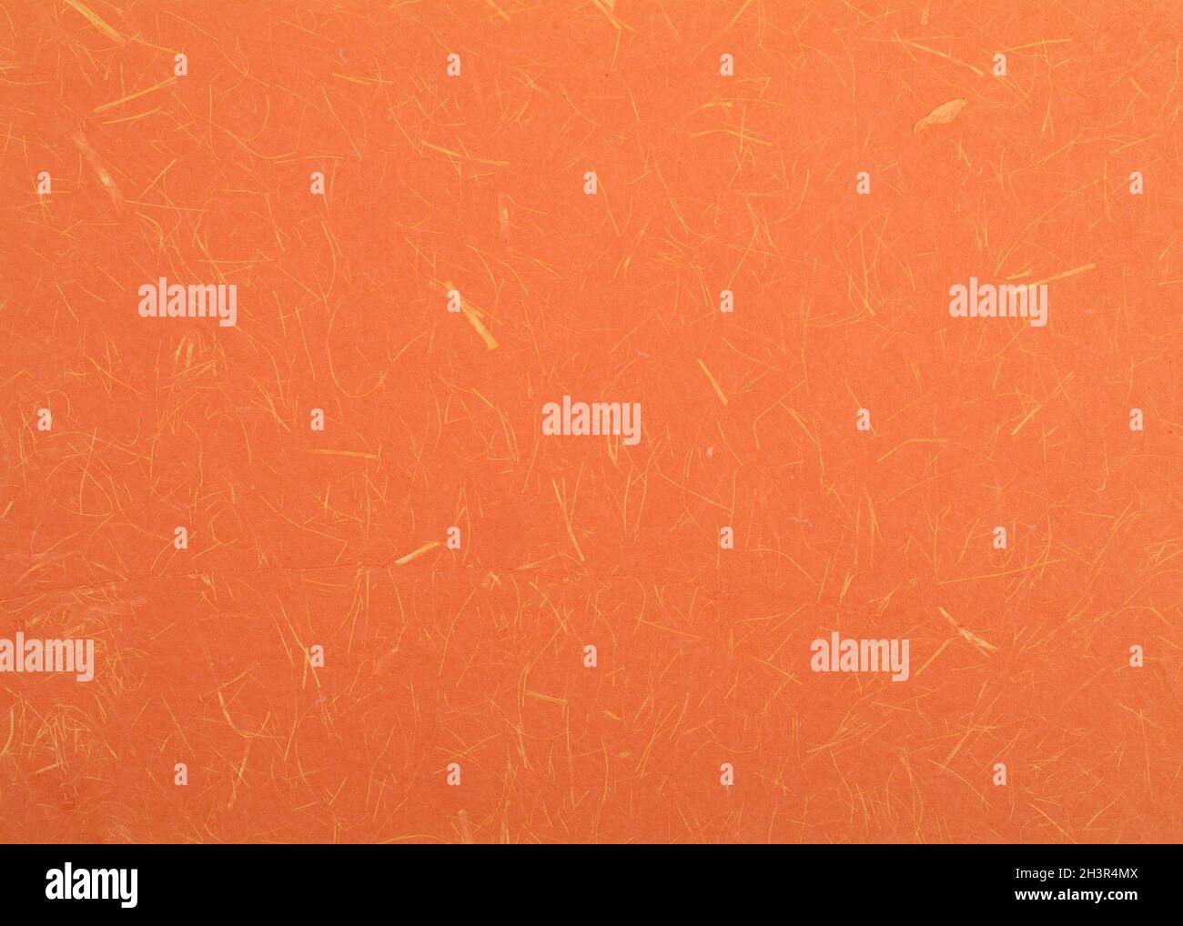 Orange textured paper background. Bright orange decorative surface. Stock Photo