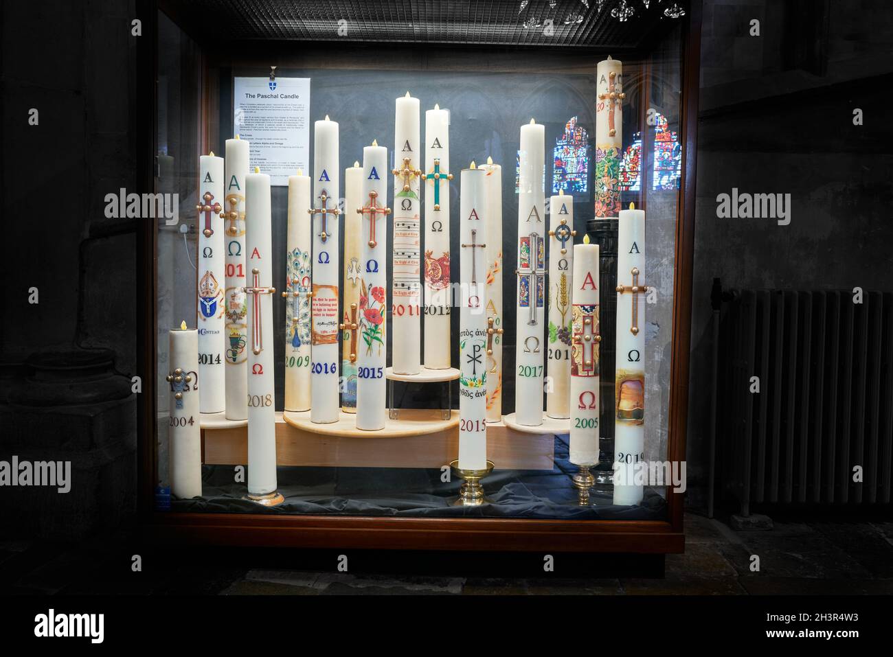 Easter candles in a display case at Canterbury cathedral, England. Stock Photo