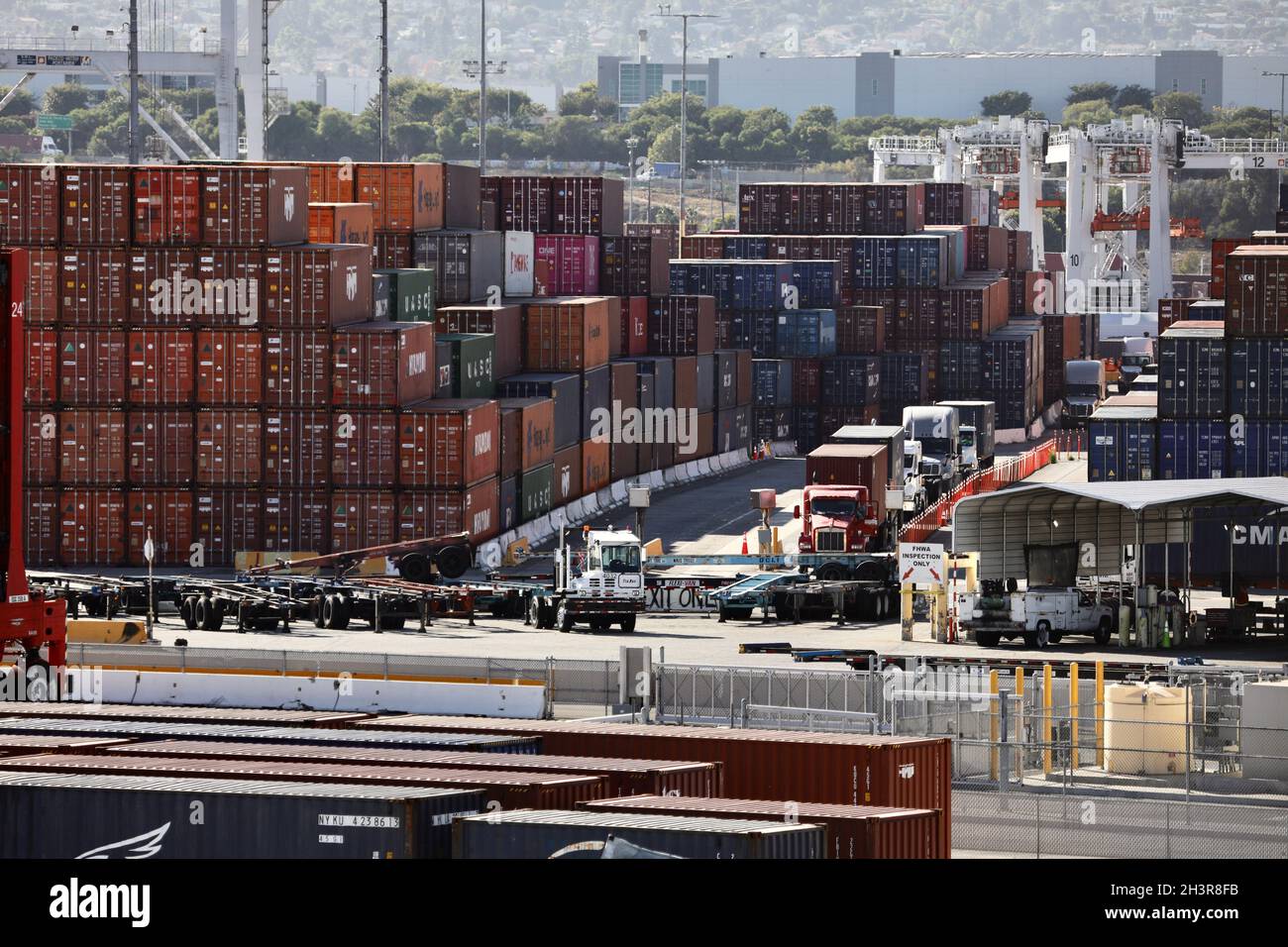 Los Angeles, USA. 30th Oct, 2021. Trucks are seen by the piled-up ...