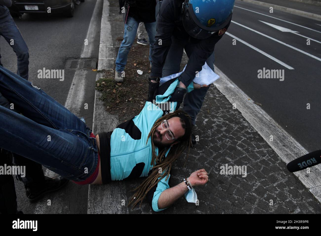 Police Carry Away An Extinction Rebellion Activist As They Block A Road Near The Ministry Of Ecological Transition During The G Leaders Summit In Rome Italy October 30 21 Reuters Maria Giulia Trombini