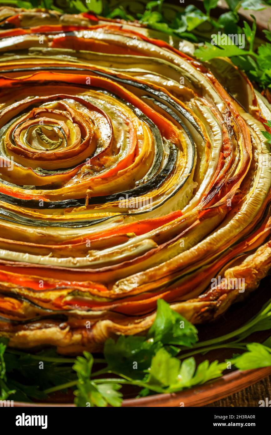 Vegetable pie Mexican sun. Round open pie made from zucchini, eggplant