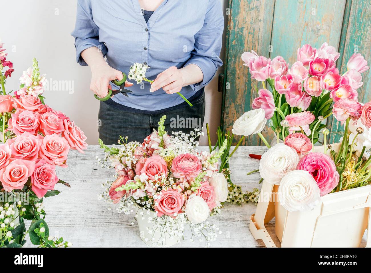 Work Sorting Roses Florist workplace: woman arranging a bouquet with roses, matthiolas ...