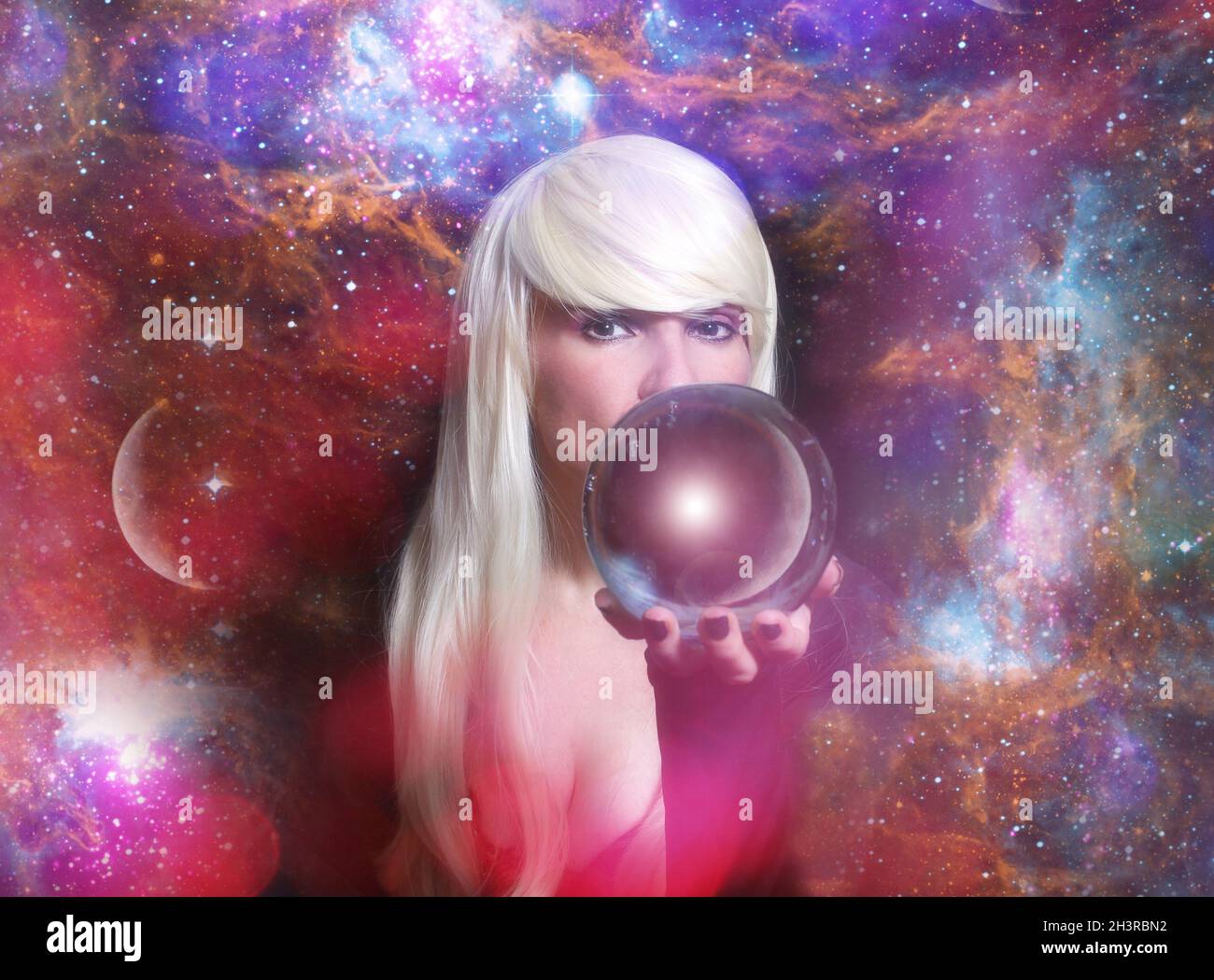 Psychic with Blond hair and Crystal Ball Stock Photo