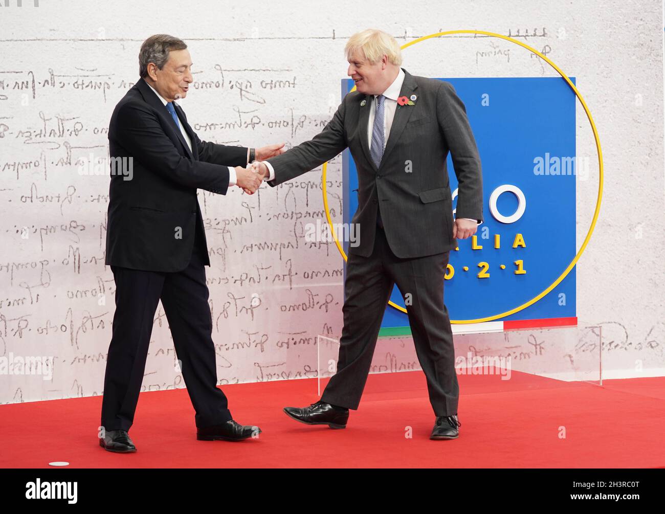 Italian Prime Minister Mario Draghi (left)welcomes Prime Minister Boris Johnson to the G20 summit in Rome, Italy. Picture date: Saturday October 30, 2021. Stock Photo
