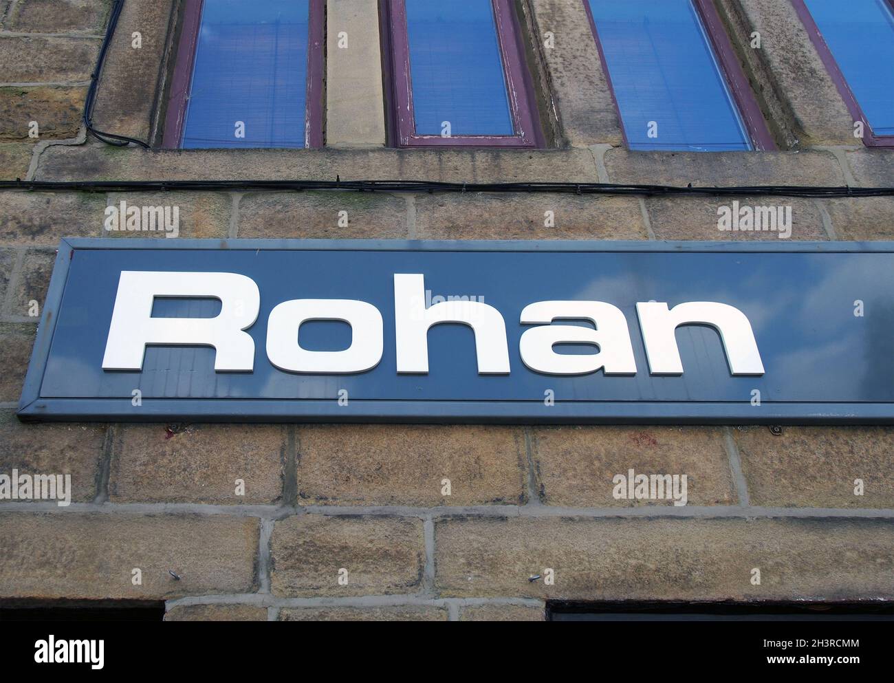 Sign above a rohan outdoor clothing store in hebden bridge Stock Photo