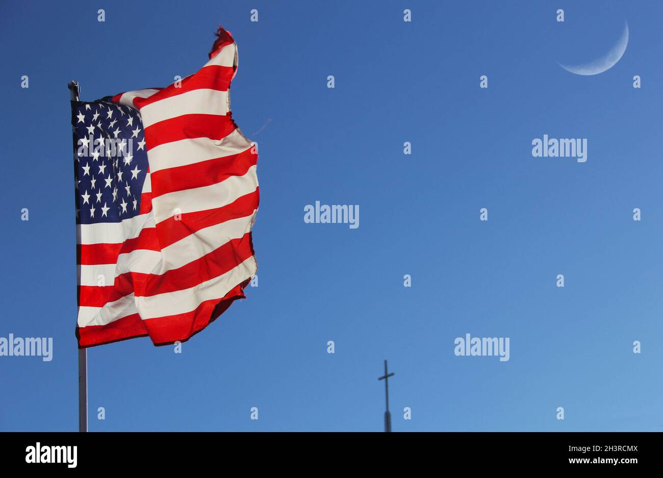 American Flag and Cross and Moon With Blue Sky Stock Photo
