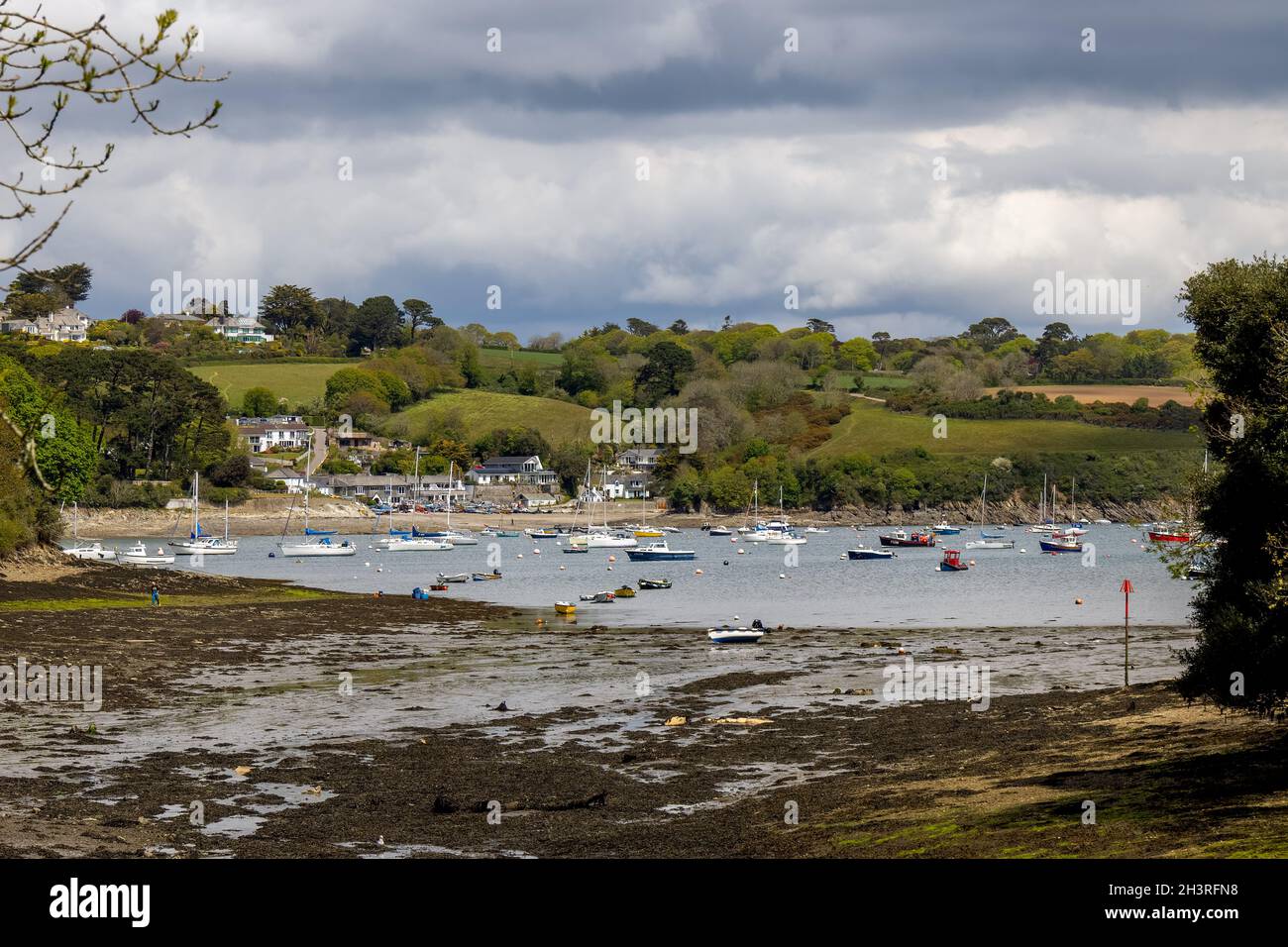 HELFORD, CORNWALL, UK - MAY 14 : View from Helford Creek at low tide in Helston, Cornwall on May 14, 2021. One unidentified pers Stock Photo